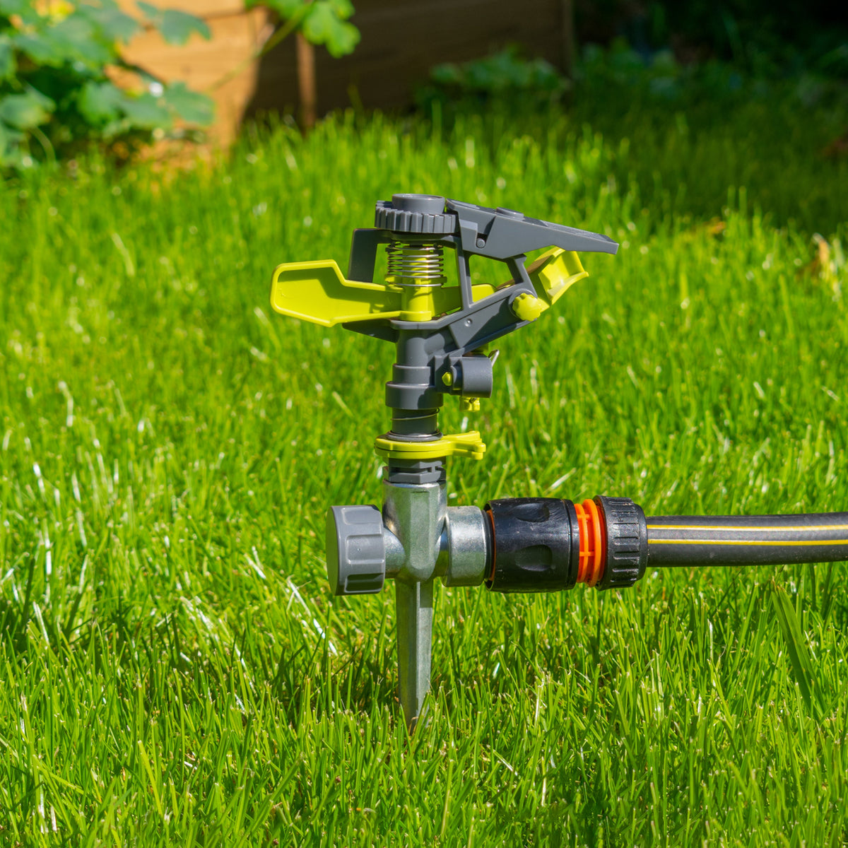 Lime Line Pulsating Lawn Sprinkler on Metal Spike