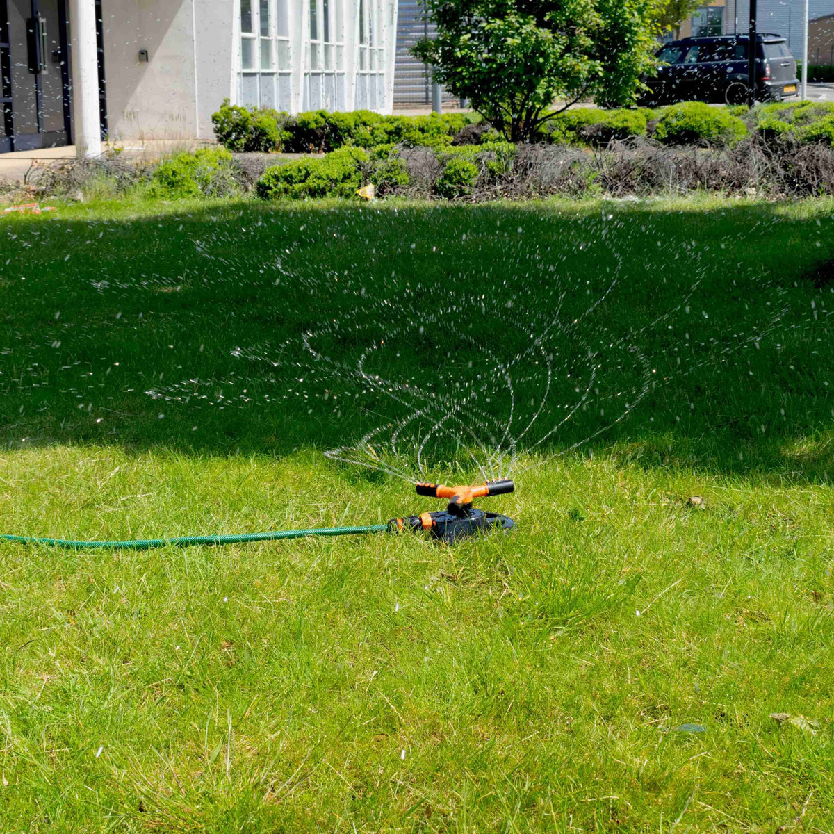 Bradas 3-Arm Rotating Sprinkler – Black & Orange