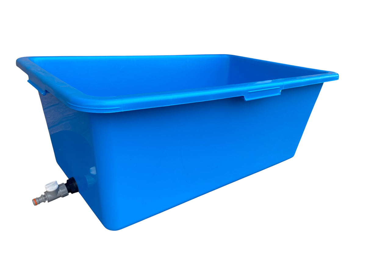 Blue rectangular dog bath with grey/white drain valve at the lower side.